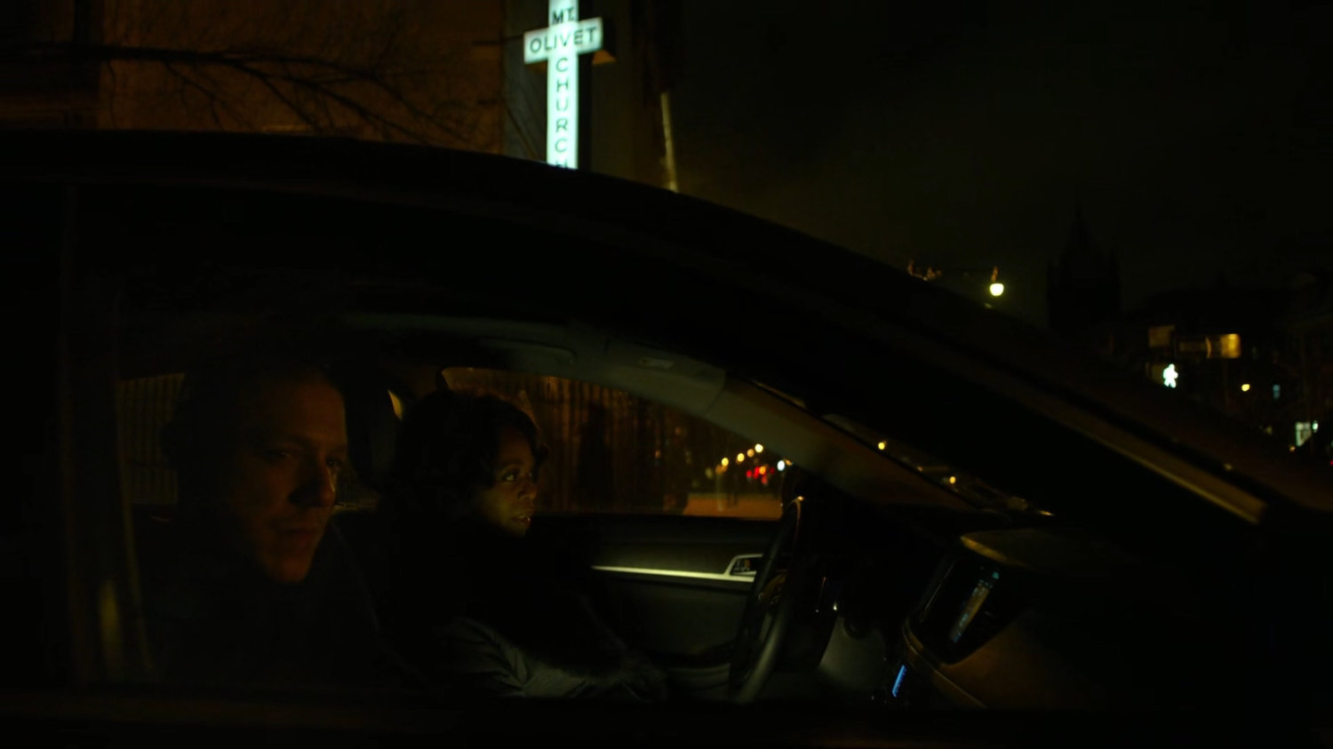 Mariah and Shades in his car parked outside Mt Olivet Church.