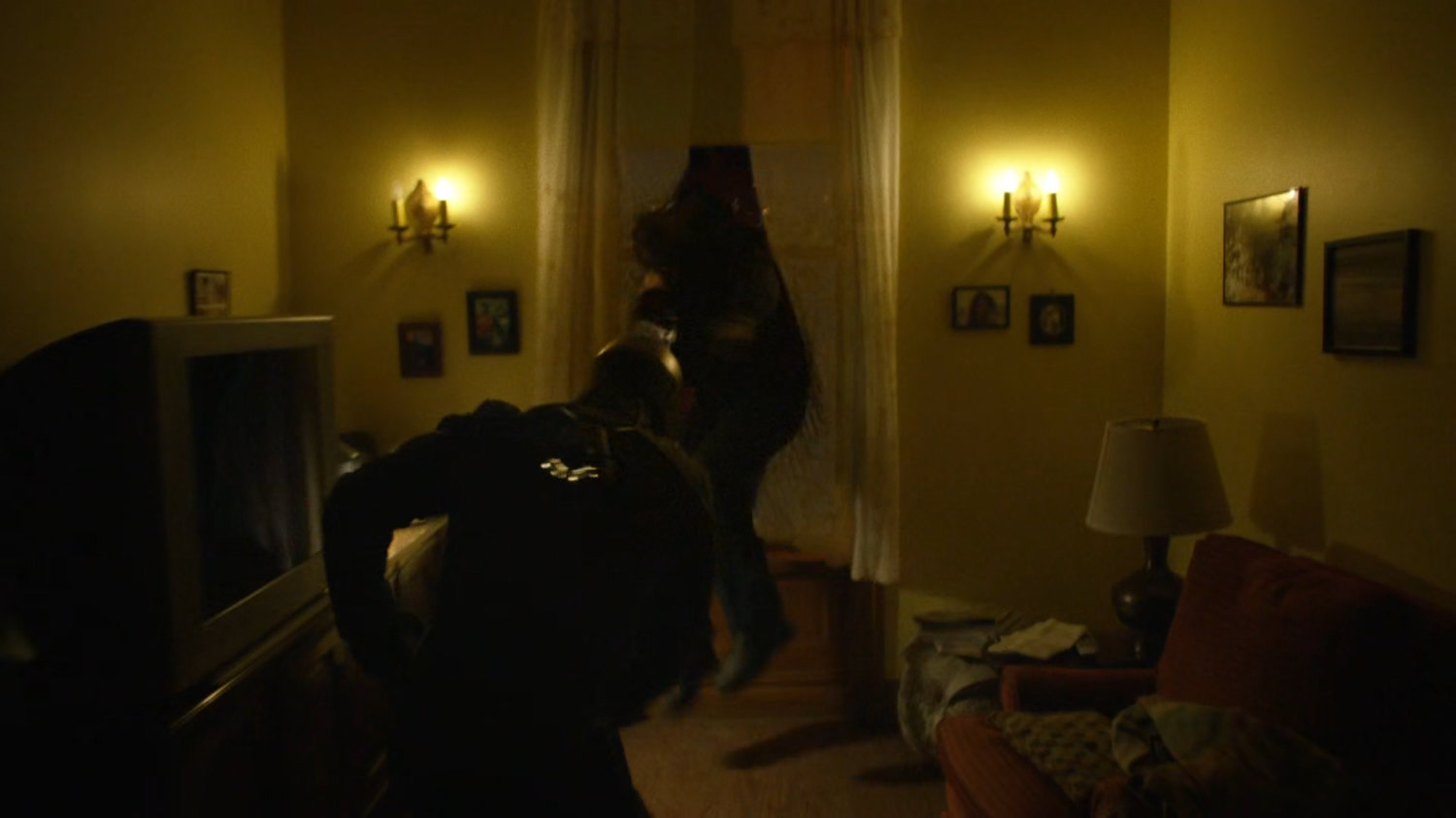 Diamondback fighting with Luke in the apartment above Pop's Barber Shop.
