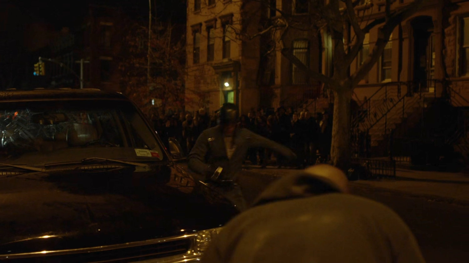 Diamond back and Luke fighting on a Harlem street.